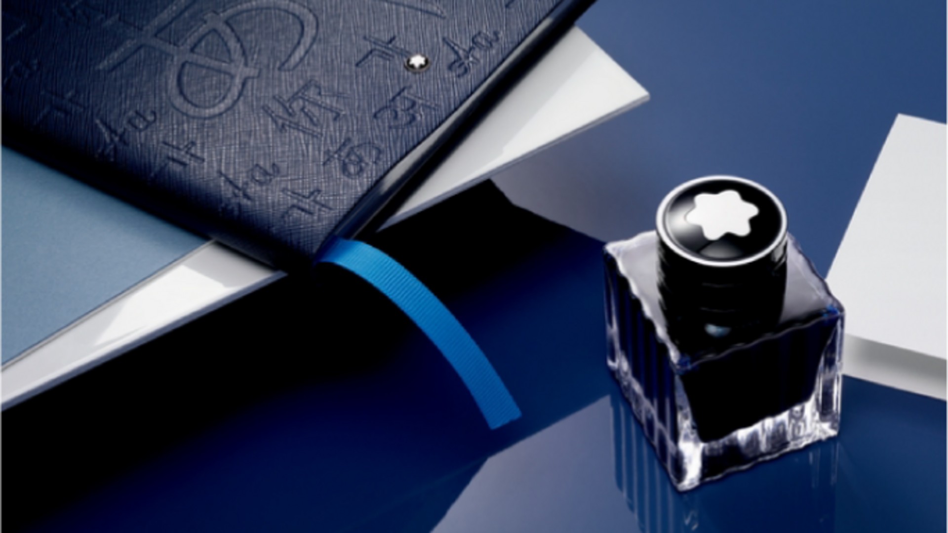Notepad and Ink Bottle Image