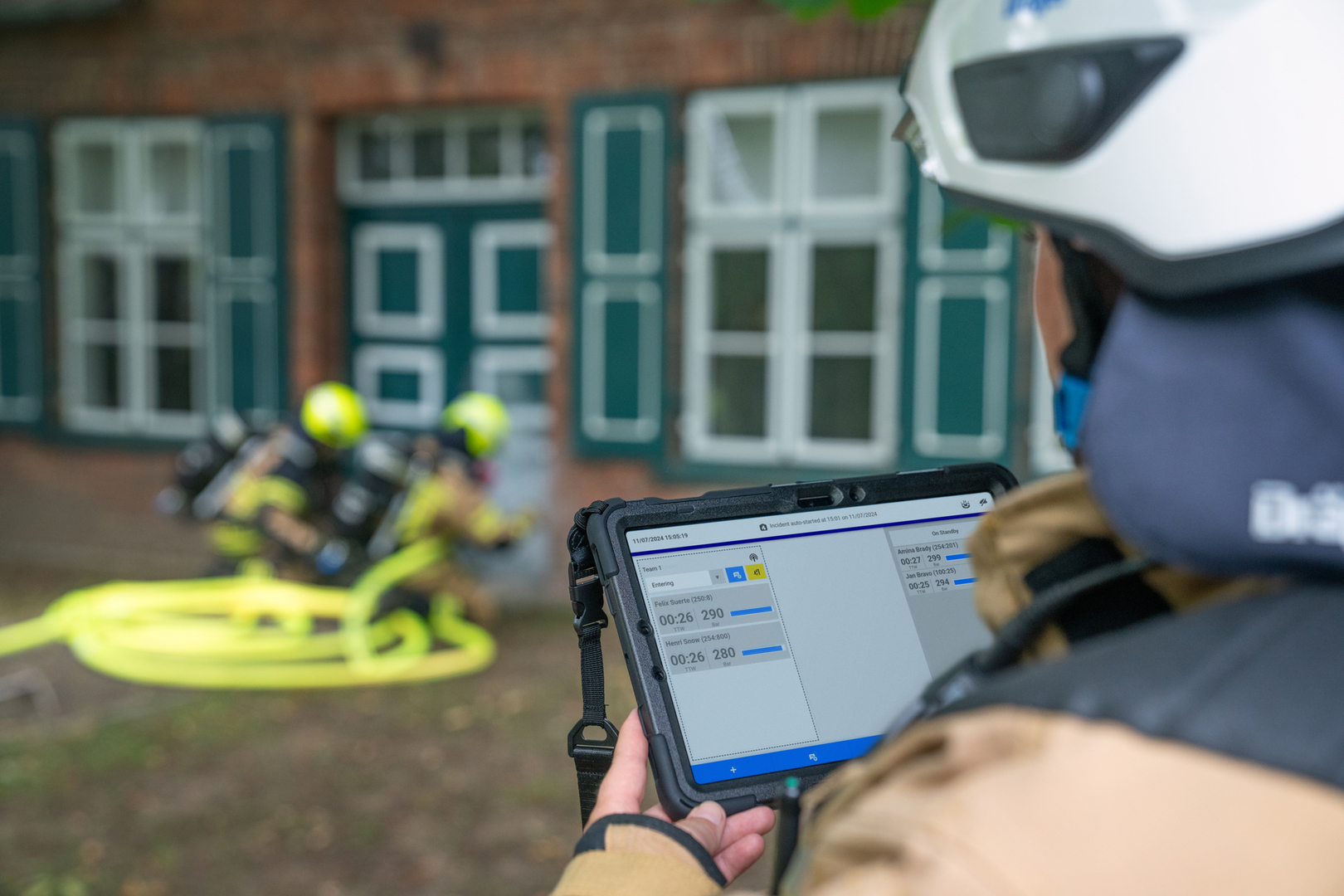 Image with tablet and fire fighters
